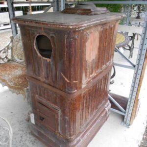 Antique stove in dark terracotta