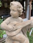 Putto su sfera chitarra