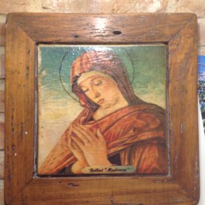 Madonna in cotto su cornice in legno