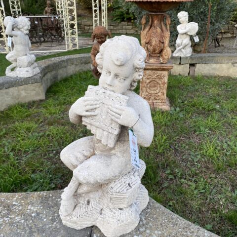 Putto in Pietra con Flauto di Pan