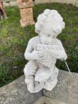 Putto in Pietra con Flauto di Pan